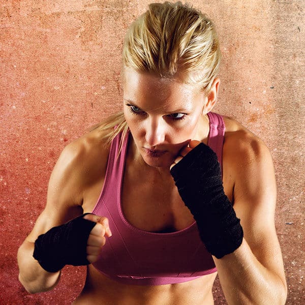 Mixed Martial Arts Lessons for Adults in Old Bethpage NY - Lady Kickboxing Focused Background