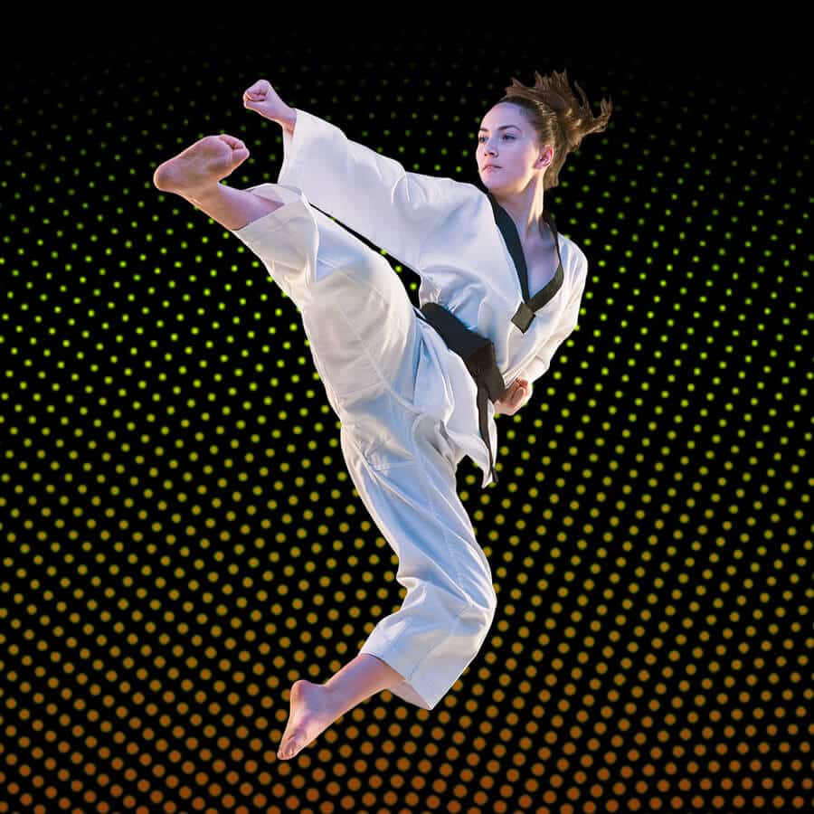 Martial Arts Lessons for Adults in Old Bethpage NY - Girl Black Belt Jumping High Kick
