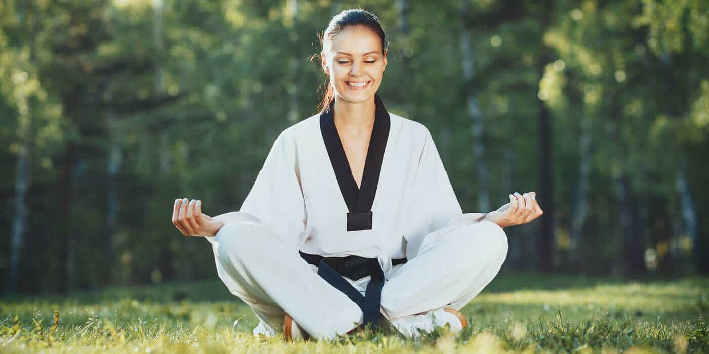 Martial Arts Lessons for Adults in Old Bethpage NY - Happy Woman Meditated Sitting Background